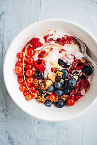 fruit salad with white cream in round white ceramic bowl thumbnail