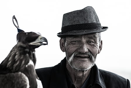 grayscale photo of man wearing hat thumbnail