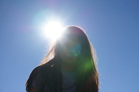 Woman Takes Photo Under the Sun thumbnail