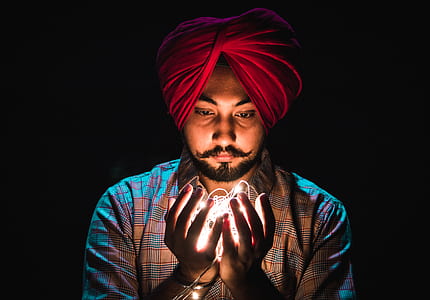 man holding string light thumbnail