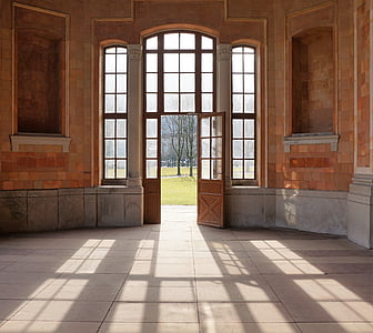 opened brown wooden doors thumbnail