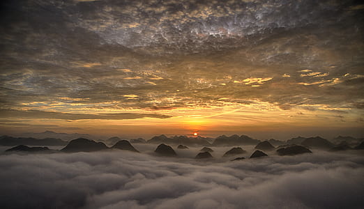 aerial view photography of mountain under nimbus clouds thumbnail