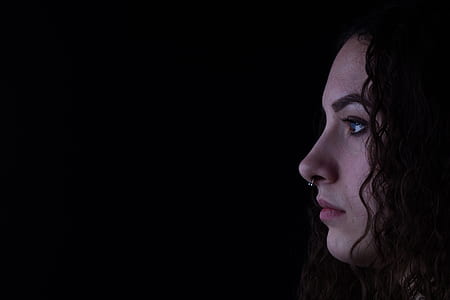close-up photography of woman's face looking sideward thumbnail