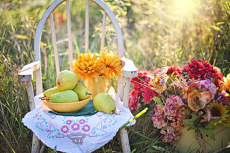 photo of pears on bowl beside flowers thumbnail
