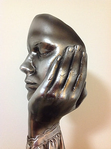 gray steel face statuette thumbnail