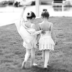 two girl's wearing sleeveless dresses photo thumbnail