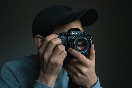 person holding camera taking picture thumbnail