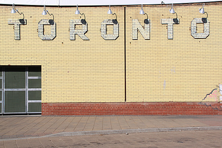 gray Toronto wall decoration with sconce light during daytime thumbnail
