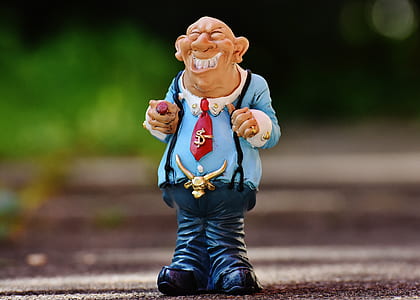 laughing man wearing suspenders figurine thumbnail