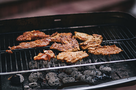 Pork and sausage on the grill thumbnail