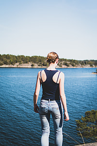 man standing near body of water at daytime thumbnail