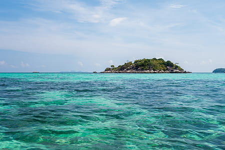 island surrounded by body of water thumbnail