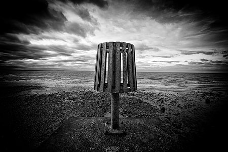 Wide-angle monochrome shot taken at the end of a groin on Whitstable Beach, Kent, England thumbnail