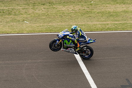 person riding Yamaha sports bike on concrete road during daytime thumbnail