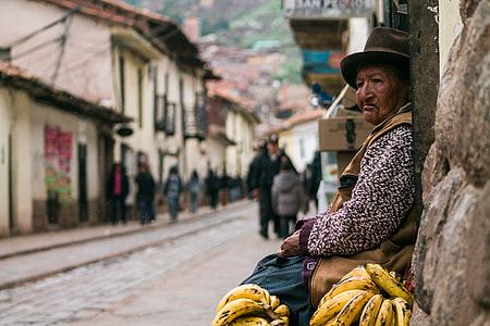 woman sitting beside pathway near banana thumbnail