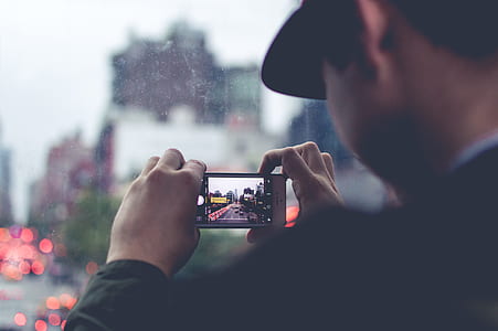 man taking selfie of city thumbnail