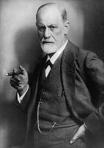 grayscale photo of man wearing blazer with cigar thumbnail