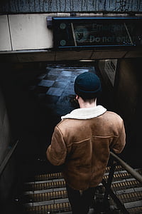 man walking downstairs thumbnail