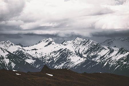 white snow on black mountain thumbnail