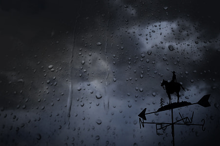 silhouette of wind direction pointer during rainy season thumbnail