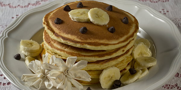 banana pancakes on white plate thumbnail