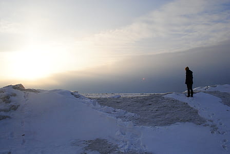 man standing on snow mountain during sunrise thumbnail
