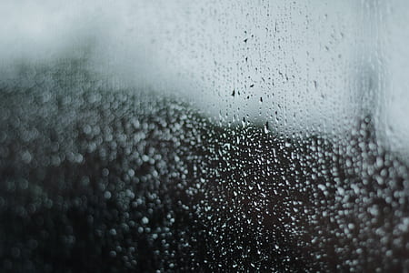 water mist through clear glass panel in selective focus photography thumbnail