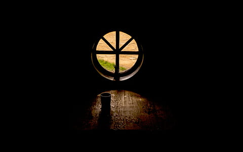 black cup beside round window thumbnail