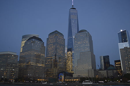 low-angle photo of high-rise buildings at nighttime thumbnail