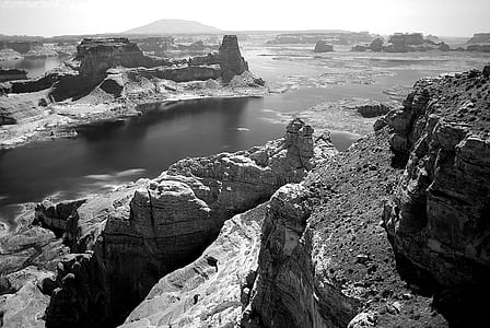 Grey Concrete Rock Beside Body of Water thumbnail