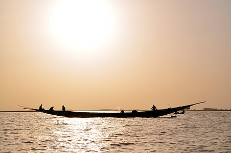 silhouette photo of person riding boat thumbnail