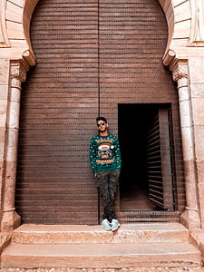 Man In Green Long-sleeved Top And Camouflage Pants thumbnail