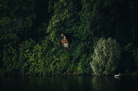 landscape photography of mountain with house beside thumbnail