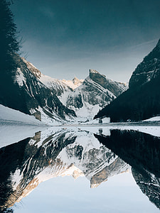 body of water near mountain thumbnail