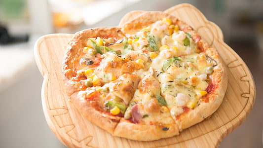 pizza on top of Hello Kitty board thumbnail