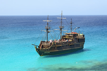 brown sailboat on sea thumbnail