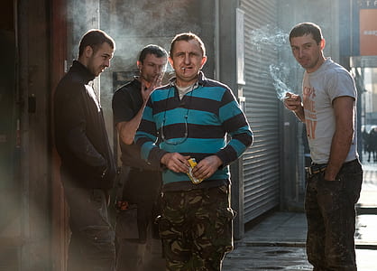 four men smoking outdoor thumbnail