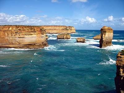 water splashing of cliffs during daytime thumbnail