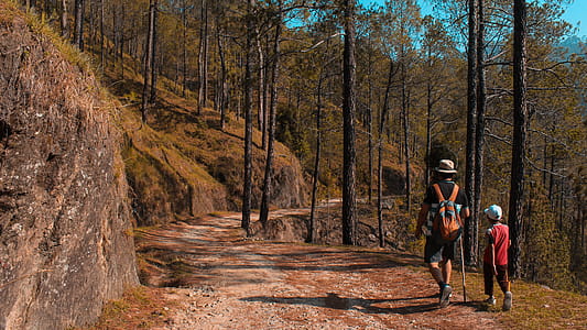 Man and Kid Walking on Downhill thumbnail