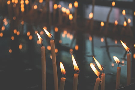 selective focus photo of lit candles thumbnail