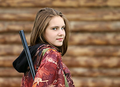 woman holding rifle portrait photo thumbnail
