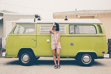 woman leaning on green van at daytime thumbnail