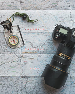 black Nikon DSLR camera on map thumbnail