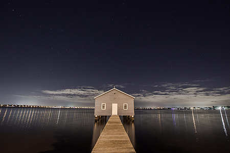 brown bungalow house on the center of sea thumbnail