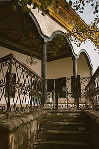 Black Metal Gate Beside House thumbnail