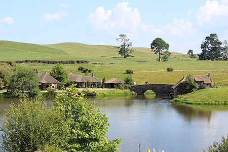 brown cabins near body of water thumbnail