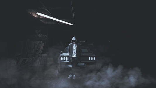 photo of man standing behind Ford Mustang thumbnail