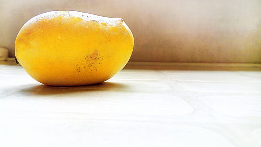 ripe mango on gray surface thumbnail