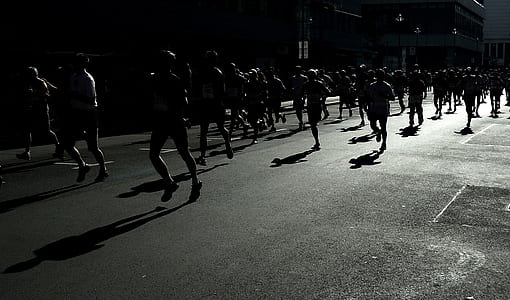 group of people running during nighttime thumbnail