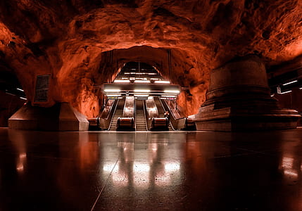 escalator in red concrete building thumbnail